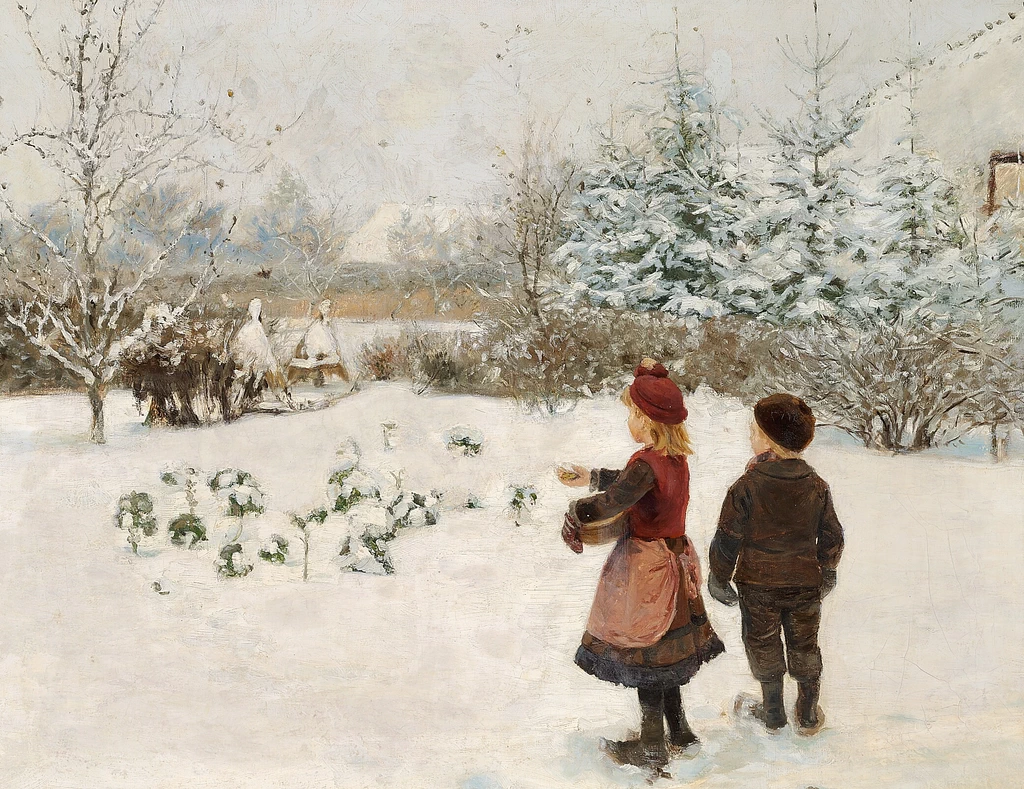 Due bambini danno da mangiare agli uccelli nella neve